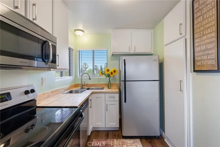 kitchen with a view of the trees of the park across the street