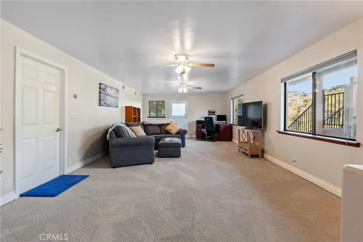 The second half of the bonus room is set up as a family room or hang out area.