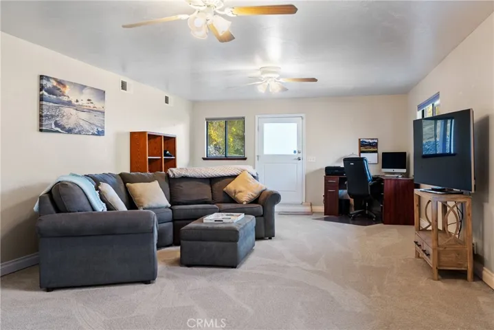 Each end of the bonus room has an exterior door to access the outside.