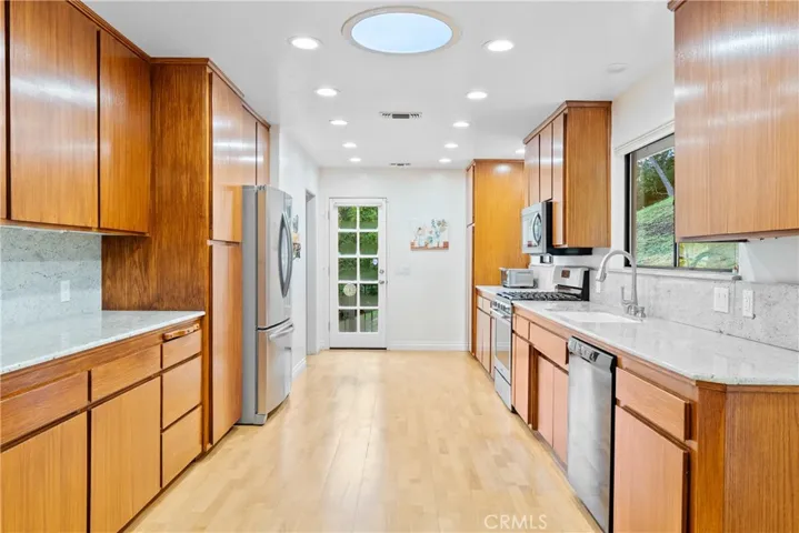 The well-appointed kitchen has abundant cabinetry for lots of storage.