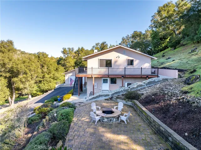 Stairs and concrete pathways lead you all around the home.