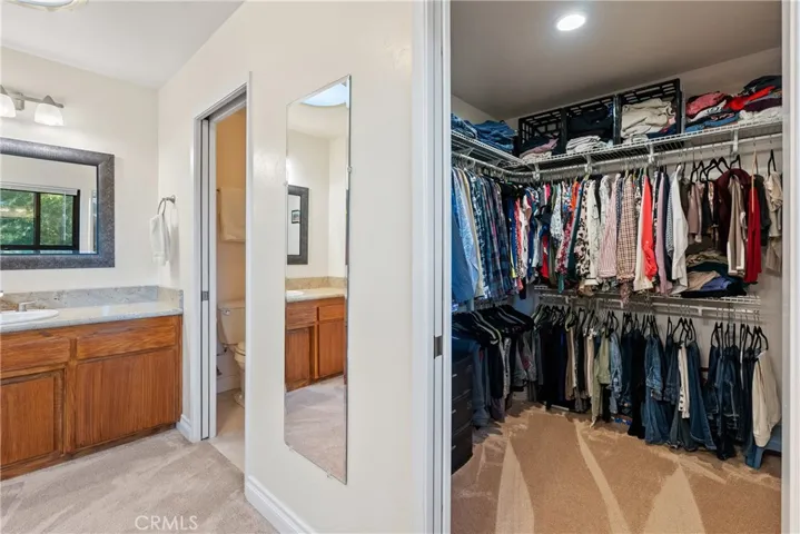 Directly off the sink area is the customized walk-in closet.