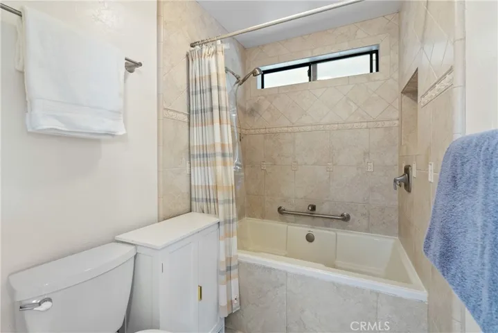 The ensuite features an extra deep soaking tub/shower combination with tile surround.