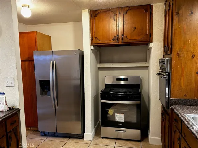 new stove and stainless steel refrigerator