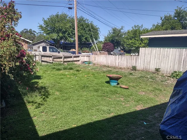 front yard area with double gate and plenty of room to park your toys