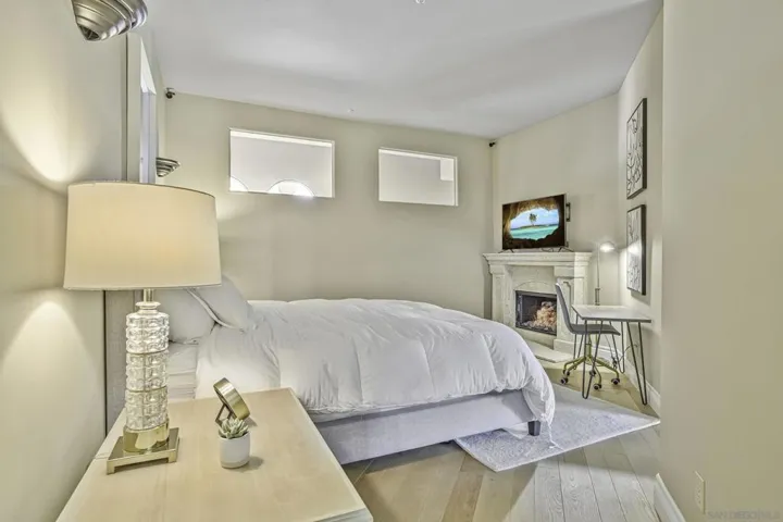 Large bedroom in guest casita has its own fireplace.