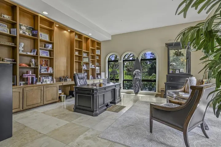 Large executive office is spacious and has direct patio access to a private sitting area.