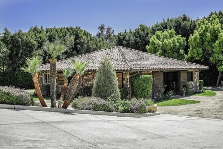 This gorgeous stone-clad stallion sized stall  main barn, can house your champion horses