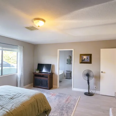 MASTER BEDROOM DECLUTTERED WITH AI