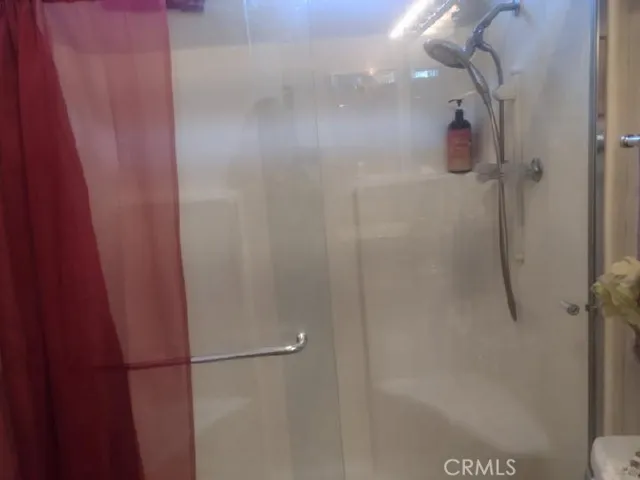 walk in shower with sitting area