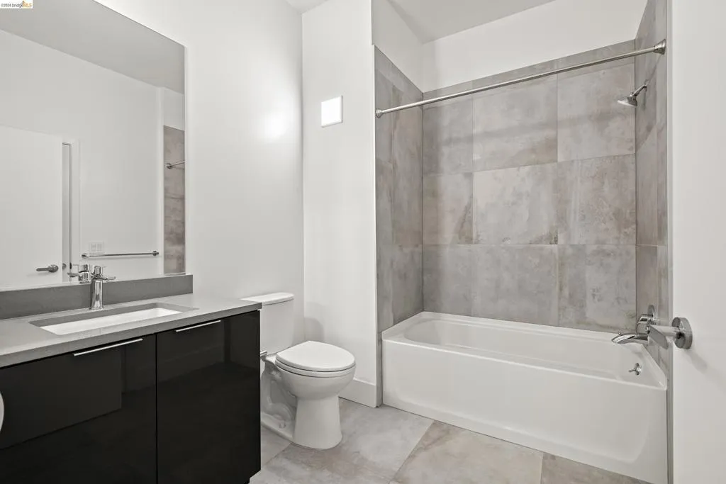 Bathroom featuring vanity and bathing tub / shower combination