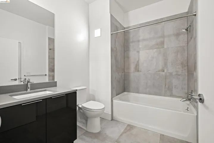 Bathroom featuring vanity and bathing tub / shower combination