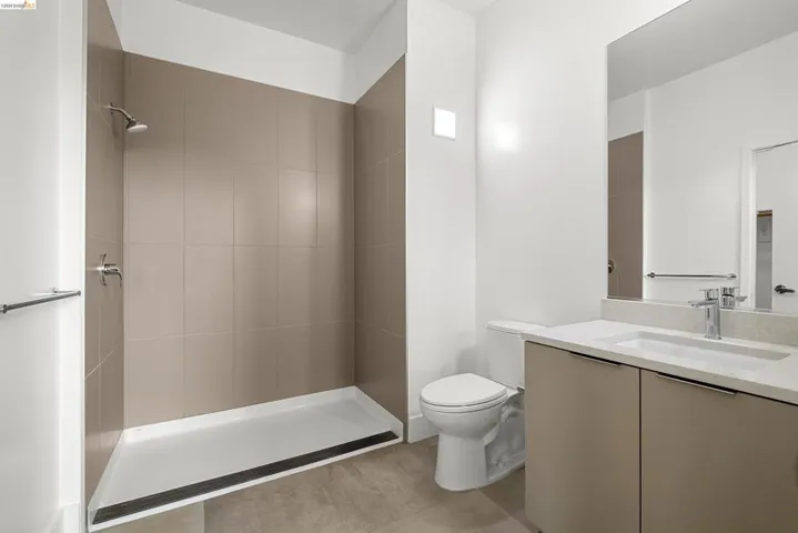 Full bath with vanity and a stall shower