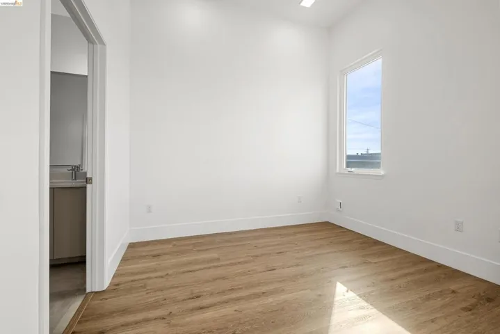 Unfurnished bedroom with light wood finished floors