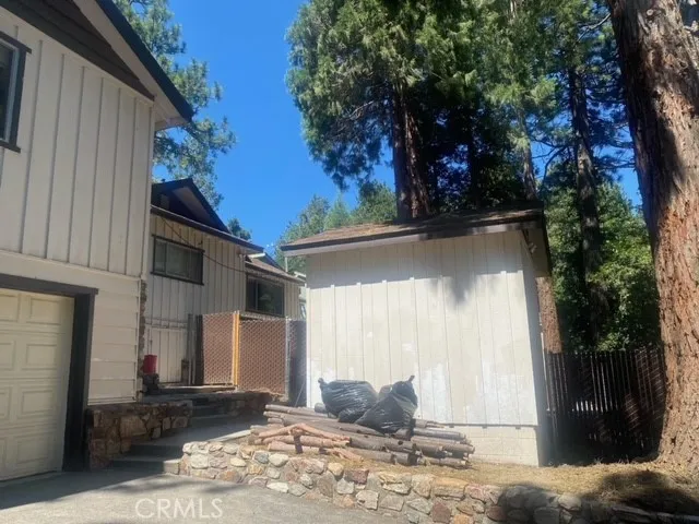 This shed on the right is currently being used for firewood.