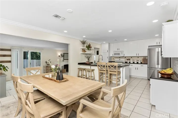 kitchen/ dining flows to living and bonus rooms