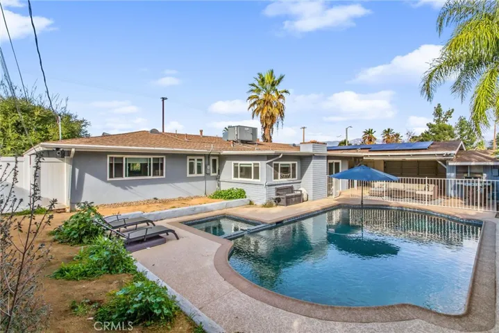 pebble tech pool and spa, lots of privacy, covered patio and fully fenced pool, dont miss the solar panels