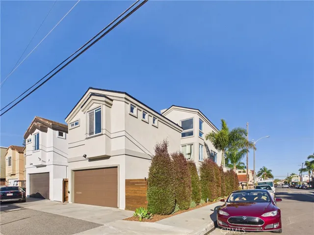 Back of home with two car garage.