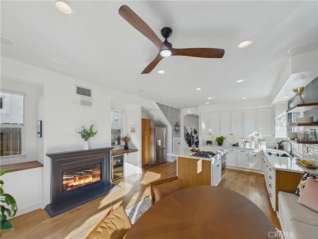 Built in freezer, wine fridge, storage and fireplace all included in the kitchen area.