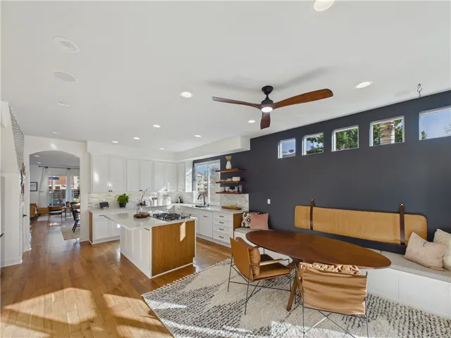 How beautiful is this! Custom bench seating right here in the kitchen area along with a full size table.