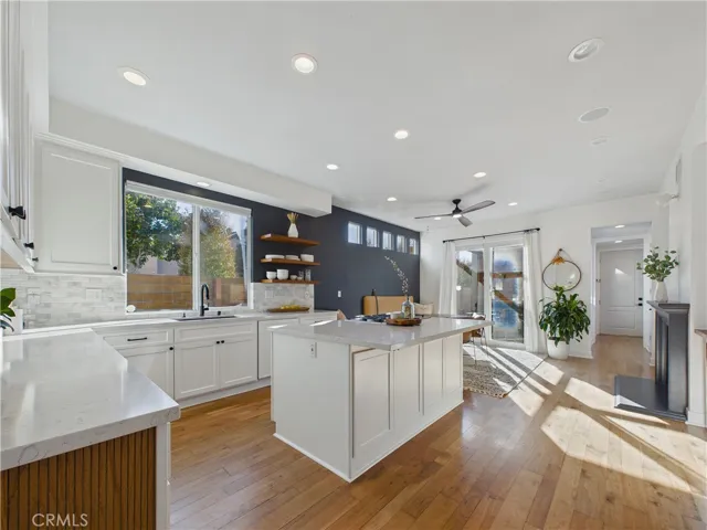 Kitchen with eat in seating, custom tile backsplash and fireplace make for great family dinners right here in the heart of the home.