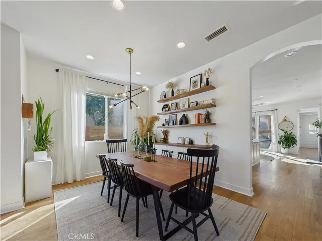 The floating shelves and custom lighting are a lovely touch to the dining room.