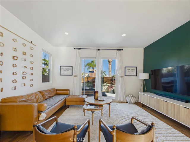 First floor formal living area opens up onto the front facing private patio.