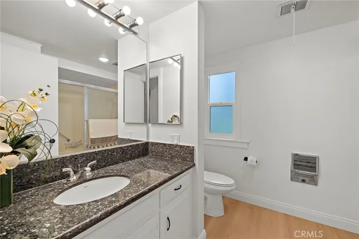 Updated Primary Bathroom with a Tub/Shower combination, and a double-pane window, new flooring and newley painted.