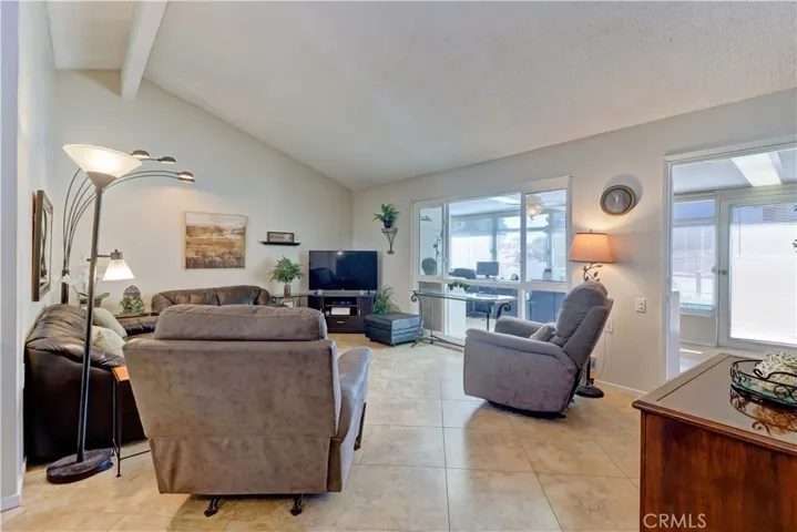 LIVING ROOM OPENS TO ENCLOSED FRONT PATIO