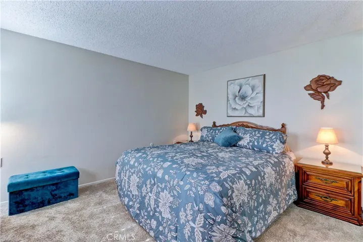 PRIMARY BEDROOM W CARPET