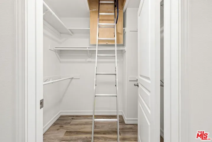 Ladder to attic storage space