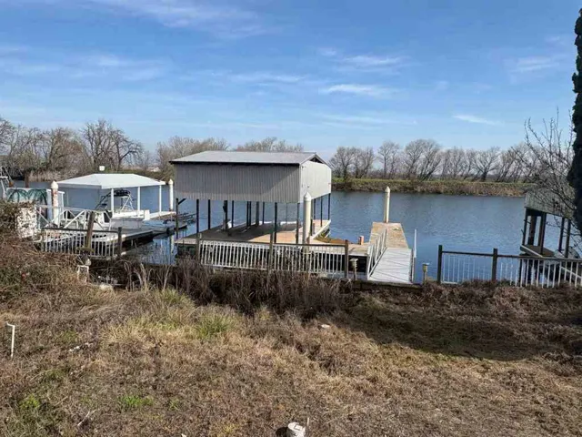 Dock with a water view and boat lift