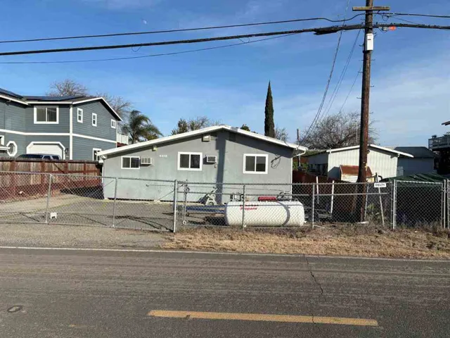 View of front of house featuring a gate and a fenced front yard
