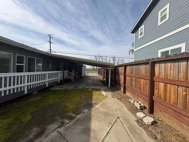 View of home's exterior with a carport