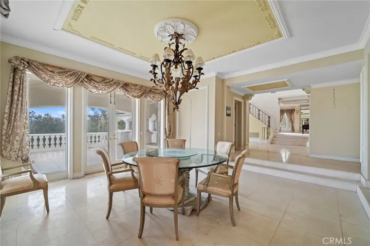 Dining room with ceiling detail and French doors