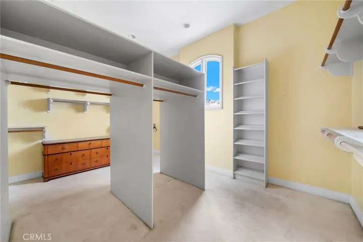 Large primary bedroom walk in closet