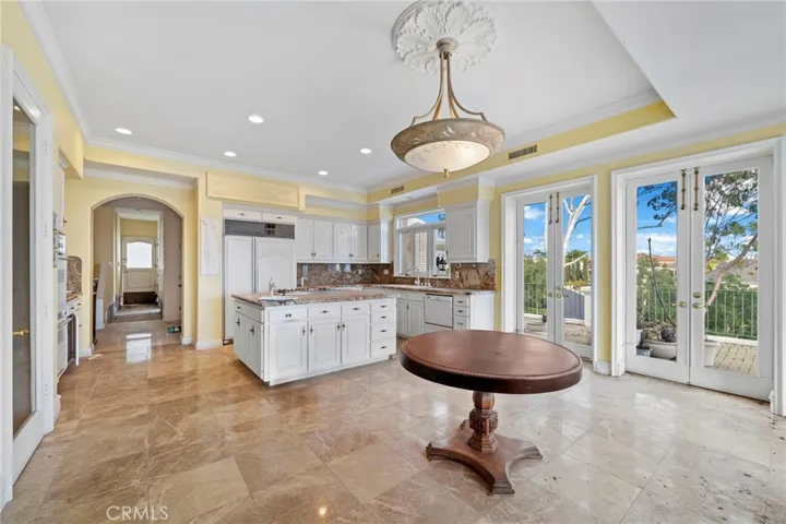 French doors to large ocean view deck & back yard