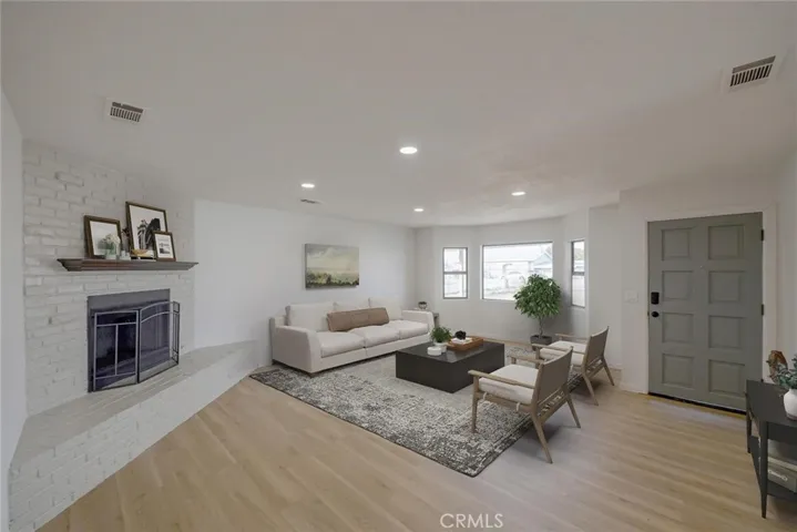 Living Room (Disclaimer: Some images have been digitally enhanced with virtual staging to illustrate potential room layouts and furnishings. Actual property condition and features may vary. Buyer to verify all information independently).