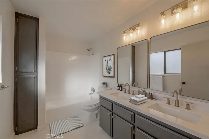Primary Bathroom (Disclaimer: Some images have been digitally enhanced with virtual staging to illustrate potential room layouts and furnishings. Actual property condition and features may vary. Buyer to verify all information independently).