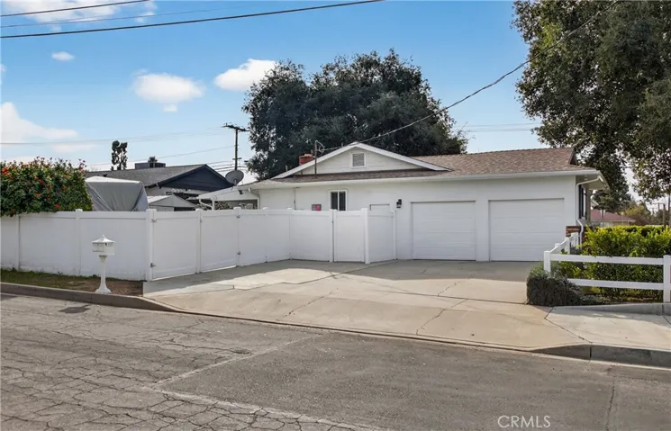 Driveway and RV 12 ft gate, 2 sep garage doors
