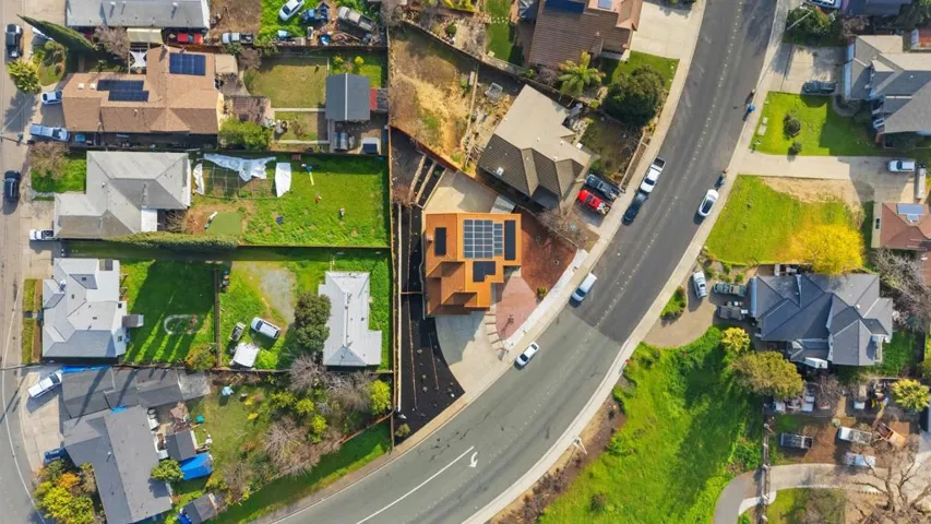 Aerial overview of property's location featuring nearby suburban area