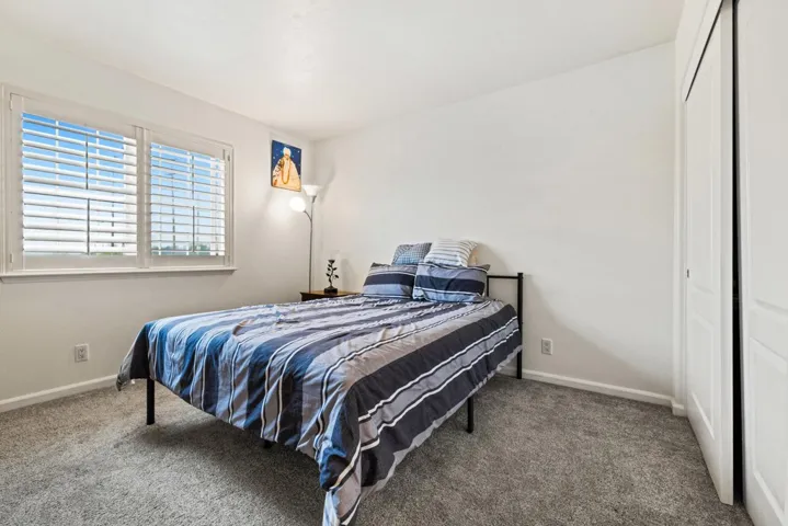 Bedroom with carpet flooring and a closet