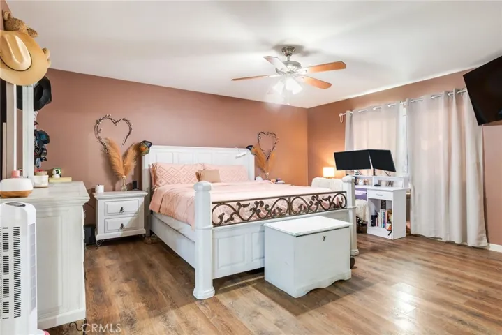 Spacious primary bedroom designed to accommodate large furniture, featuring two generous walk-in closets.