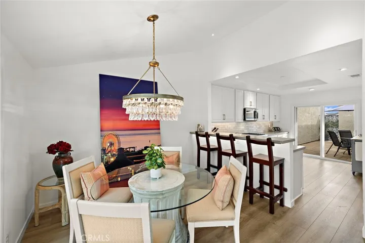 From the kitchen, enjoy a seamless view into the private courtyard — an inviting space for outdoor grilling, dining, and relaxed gatherings.