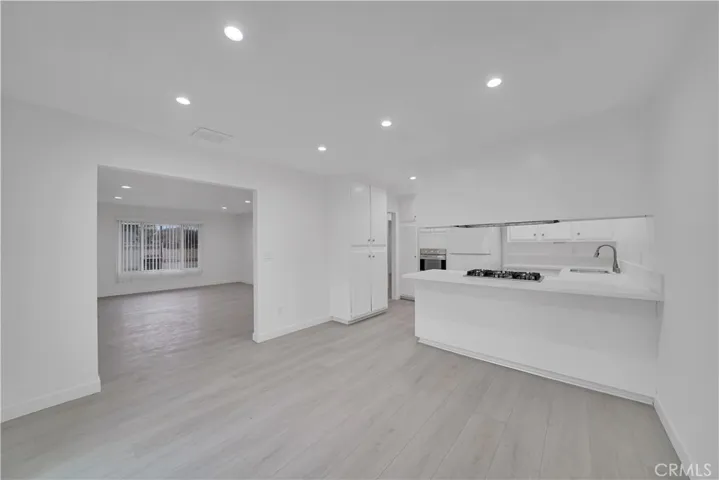 Counter bar seating in the kitchen. Lots of light throughout.