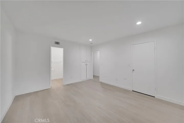 Master bedroom has walk in closet and cabinet space.