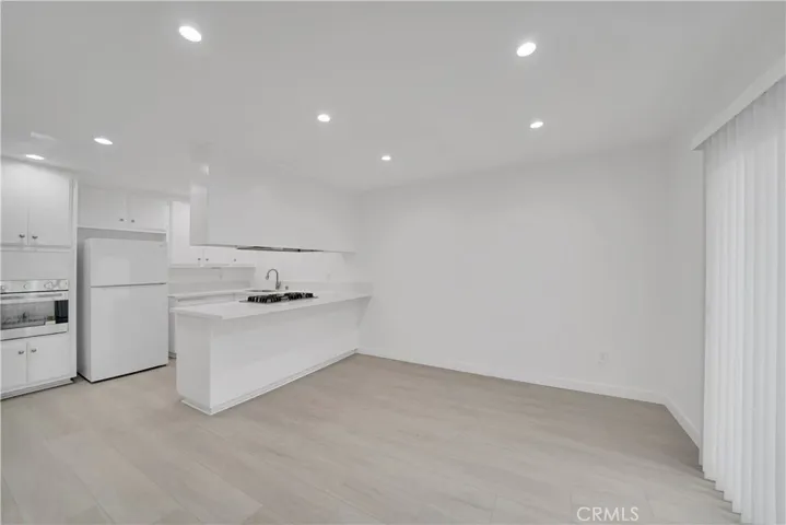Dining room has plenty of space for table and chairs and space for barstools too!