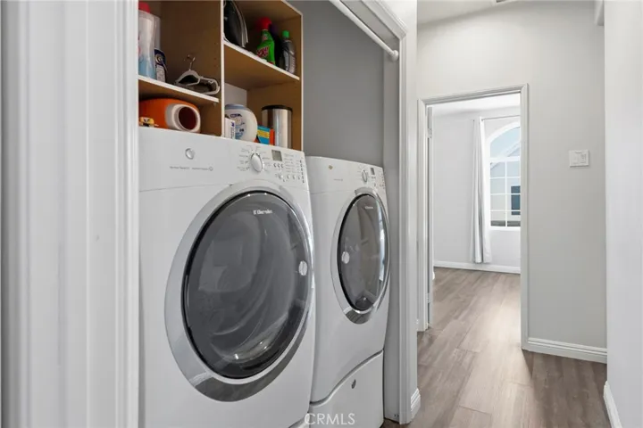 An upstairs laundry area adds everyday convenience.