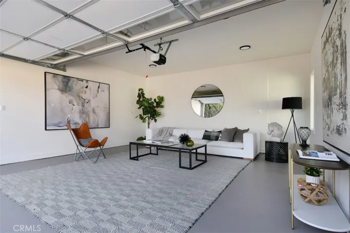 7907 Vicksburg Ave.- Garage is fully finished with ceiling lights, window, EV charger