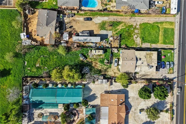 Overhead view of 2 front units and extensive rear lot.